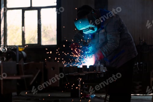 Preview: Industrial welder welding metal profiles