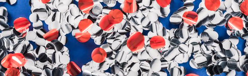 Preview: Panoramic shot of multicolored confetti on blue background