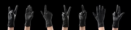 Preview: Hands in black gloves showing different gestures on black background, collage