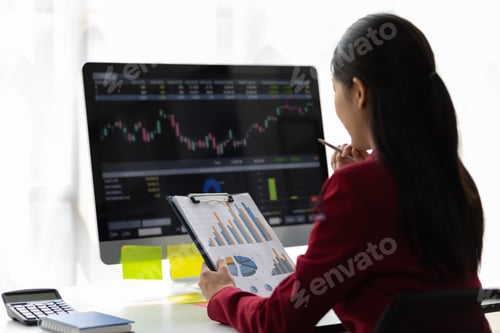 Preview: Businesswoman analysis financial data charts and graphs to plan business investment strategies.