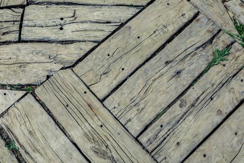 Preview: Close up of weathered wooden planks arranged diagonally outdoors in natural light