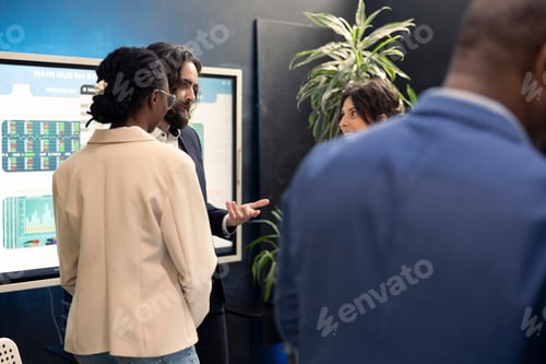 Preview: Team of corporate workers preparing their presentation pitch