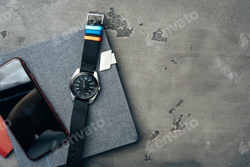 Preview: Men's accessories such as smartphone and watch on dark grey table