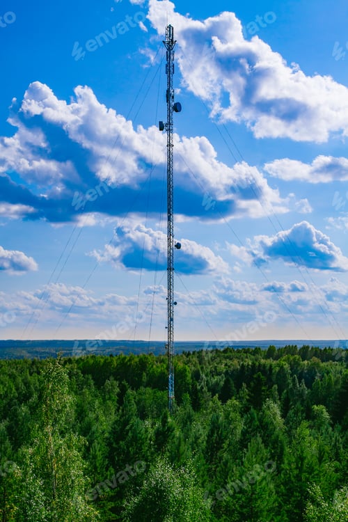 Preview: Aerial drone view of 5G telecommunication tower. Telecommunication tower over green woods in Finland