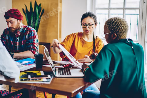 Preview: Diverse students communicate during together studying indoors