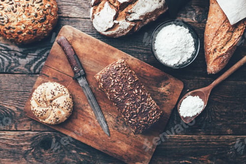 Preview: Delicious fresh bread on wooden background