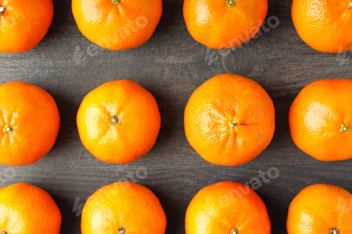 Preview: Flat lay with tasty mandarins on textured wooden table