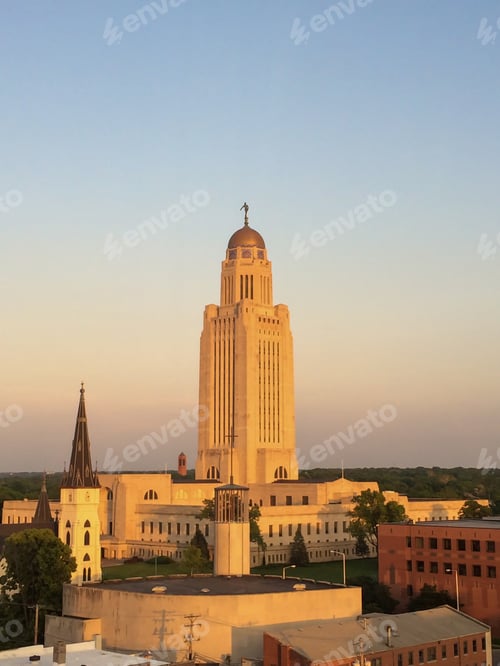 Preview: Sunset reflected on the Nebraska State Capitol building located in Lincoln, Nebraska. United States