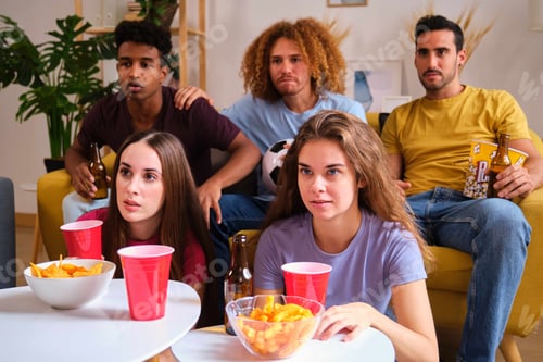 Preview: Group of friends stared intently the soccer close game match.