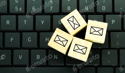 Preview: wooden cube with email icon.