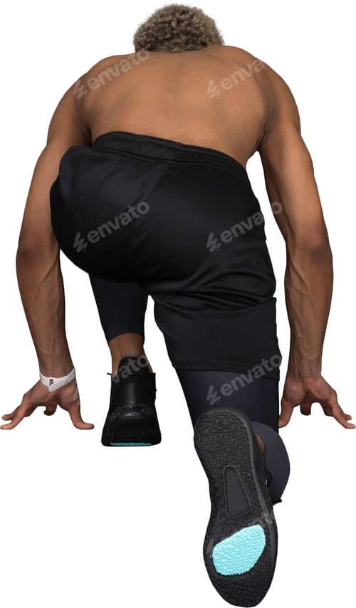 Preview: a man in black shorts and black shoes kneeling on the floor