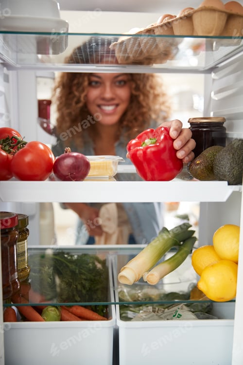 Preview: View Looking Out From Inside Of Refrigerator As Woman Opens Door And Unpacks Shopping Bag Of Food