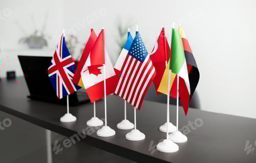 Preview: Many Different Countries Flags And Laptop Standing On Office Table