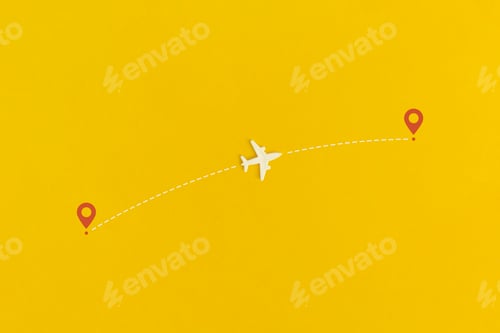 Preview: Toy airplane on a yellow background. Top view. Flat lay.