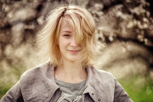 Preview: Portrait of young blonde hair girl with no make up, smiling looking at camera.