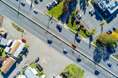 Preview: View from air of a road intersection during rush hour with heavy traffic moving