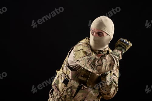Preview: front view young soldier in uniform on black background warrior tank military israel