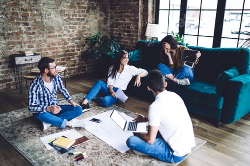 Preview: Content multiethnic coworkers discussing business