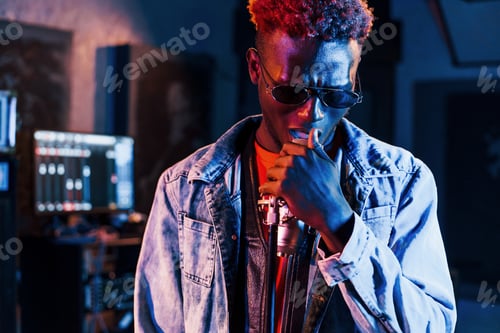 Preview: Young african american performer rehearsing in a recording studio