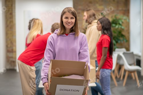 Preview: Volunteers working in a donations distribution center