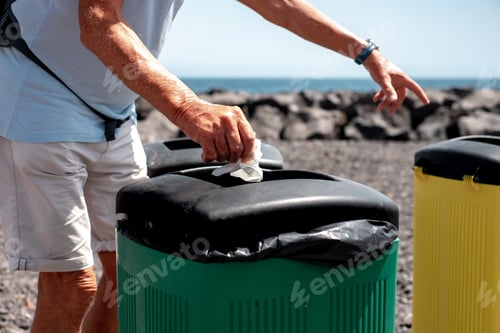 Preview: Hand of Caucasian Senior Man Throwing Away Waste in Recycle Containers, Differentiated Collection