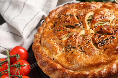 Preview: Tasty homemade pie and fresh tomatoes on grey table