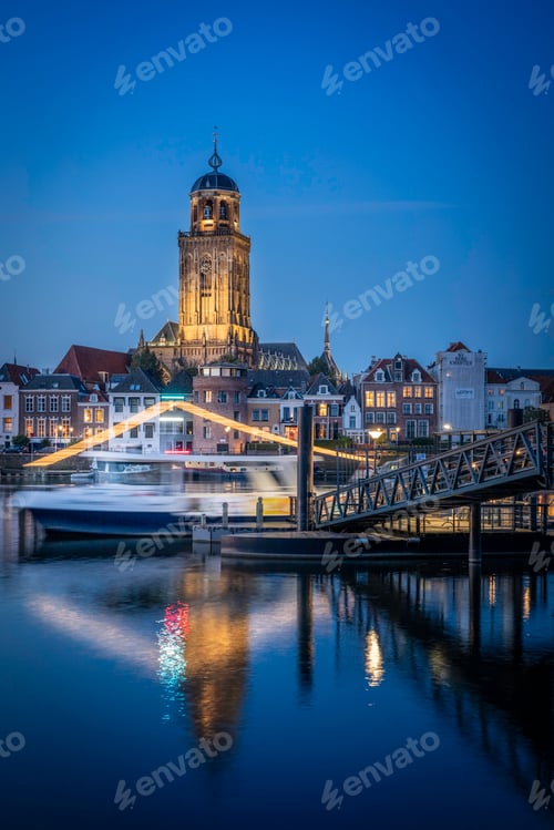Preview: a ferry going over the water in front of a building
