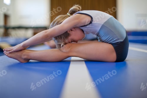 Preview: Girl doing gymnastics exercise on floor
