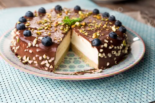 Preview: Delicious Chocolate Cheesecake with Blueberries and Pistachios