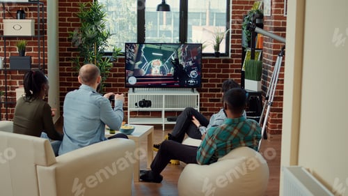 Preview: Multiethnic group of people playing video games and losing