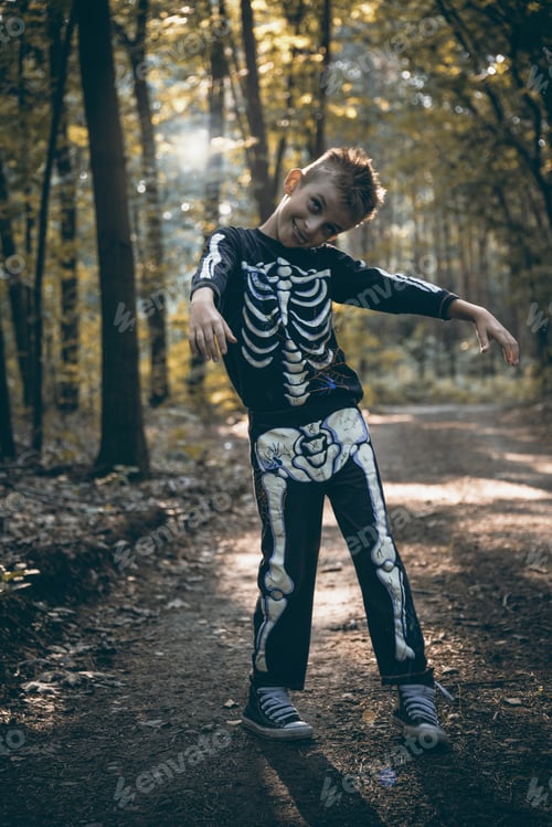 Preview: Young boy skeleton walking zombie in forest at halloween