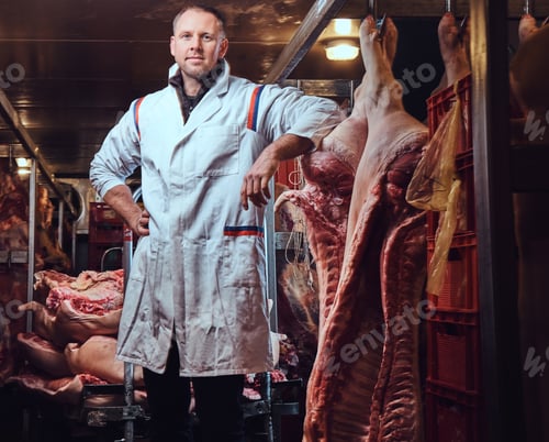 Preview: The butcher in a meat factory.