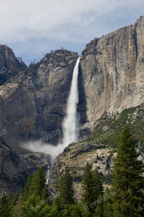 Preview: Powerful waterfall over rocky mountain