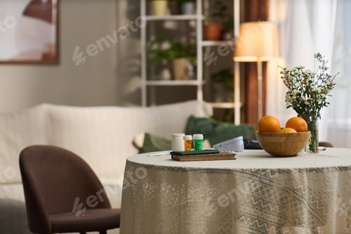 Preview: Closeup of Prescription Medication Bottles and Oranges on Table in Living Room