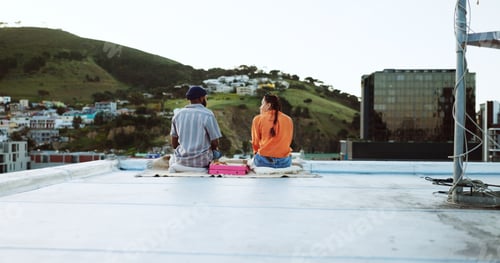 Preview: Couple, city rooftop and relax together with love, friendship and romance during a sunset picnic. U