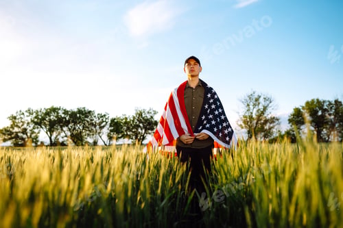 Preview: Man hold waving american USA flag. Patriot raise national american flag. Independence Day, 4th July.