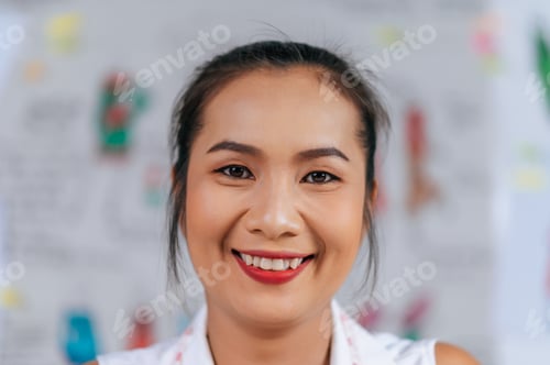 Preview: Happily young fashion designer female smile in tailor shop
