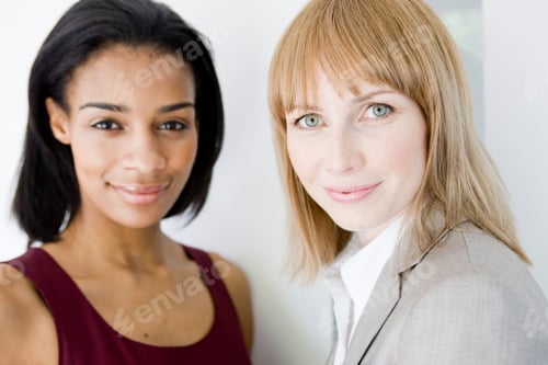 Preview: 2 businesswomen looking at viewer