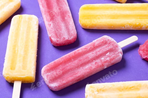 Preview: Red strawberry popsicles and yellow popsicles on purple background