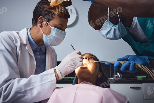 Preview: Shot of a young woman having dental work done on her teeth