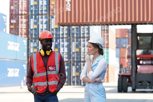 Preview: Foreman control loading Containers box from Cargo freight ship for import export.