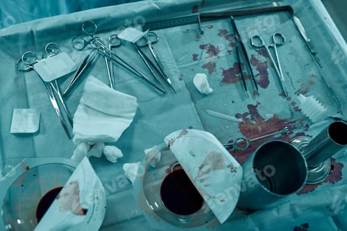 Preview: Close up of medical surgical equipment or tools being used for an operation in operating theater at