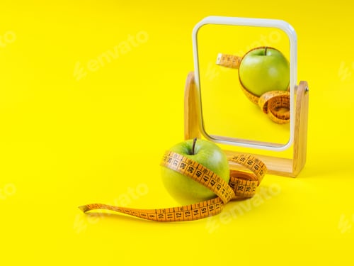 Preview: Apple with measuring tape reflected in the mirror