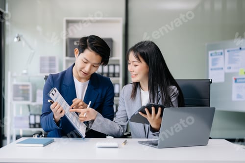Preview: Portrait of success business people working together in office. Couple teamwork startup concept