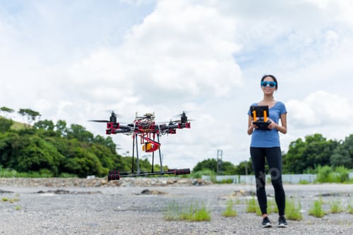 Preview: Young Woman control with drone