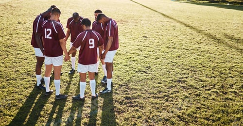 Preview: Men, huddle and team holding hands on grass field for sports motivation, coordination or collaborat