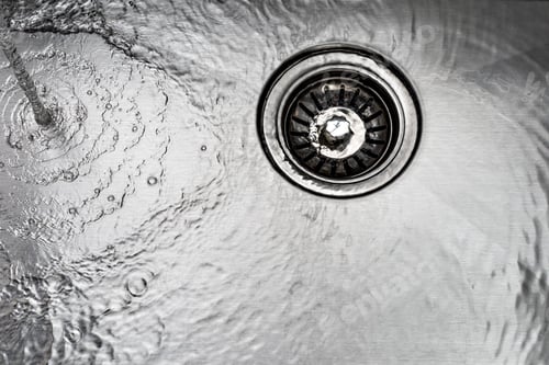 Preview: water drains down a stainless steel sink