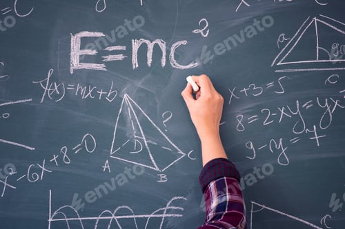 Preview: Teacher or student writing on blackboard during math lesson in school classroom