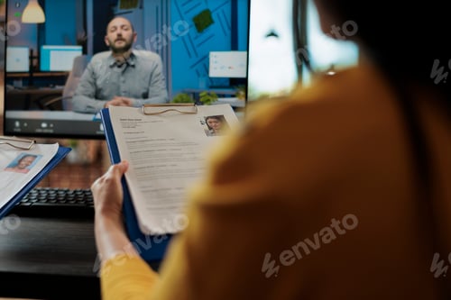 Preview: Businesswoman reading freelancer cv discussing hiring offer