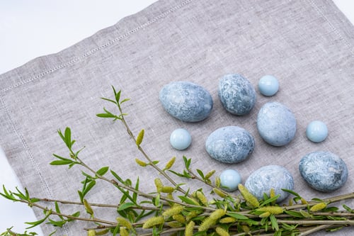 Preview: Marble Easter eggs and willow twigs on a gray linen napkin. Easter greeting card.